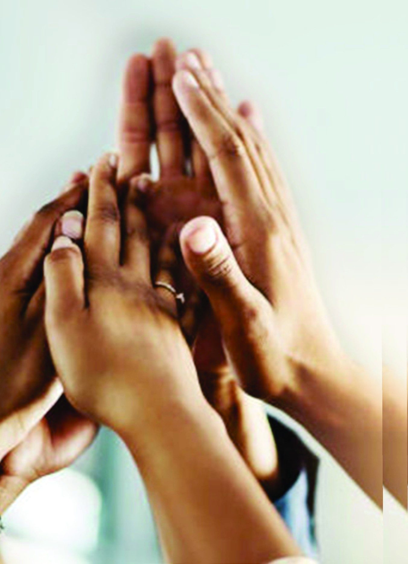 Hands joined together in a gesture of teamwork